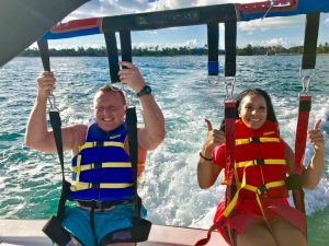 A couple is ready for take off on their parasail flight.
